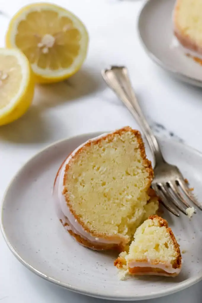 lemon sour cream pound cake slice on a plate with a fork