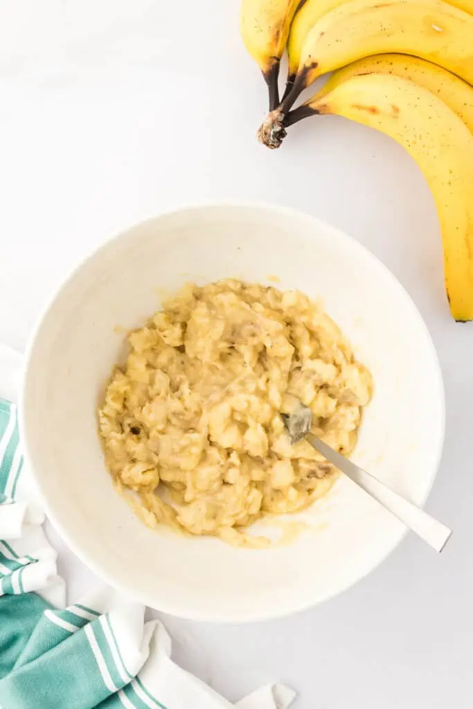 mashed bananas in a bowl with a fork