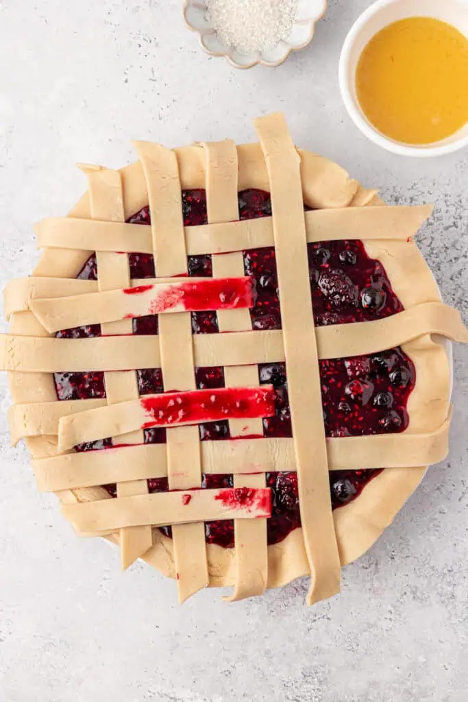lattice top being assembled on top of pie