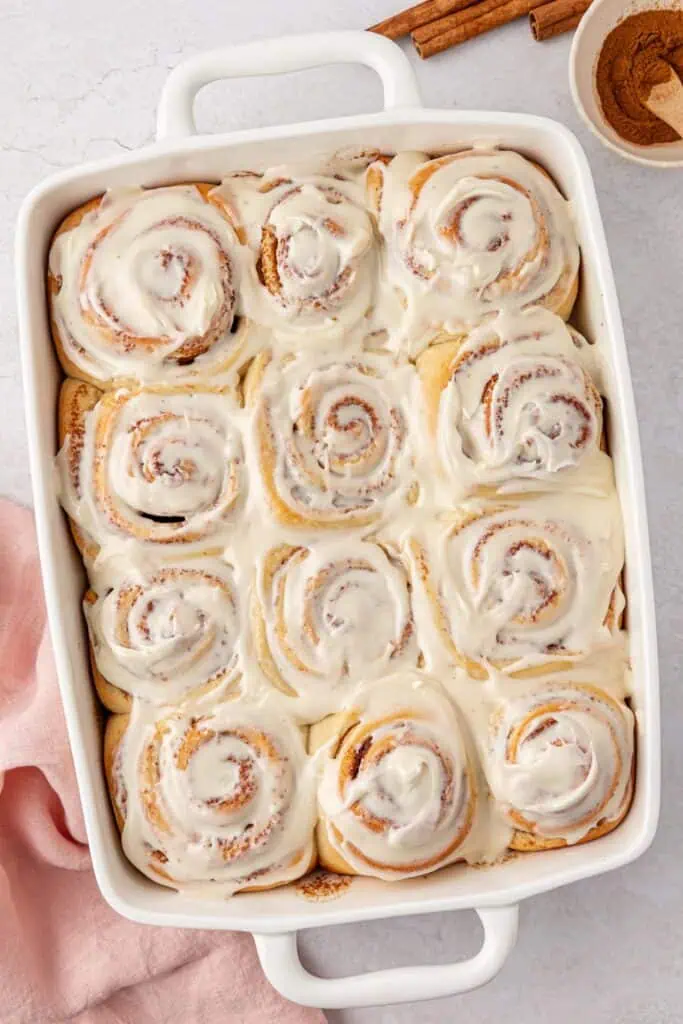 a pan of frosted cinnamon rolls