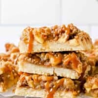 three caramel apple bars stacked on top of each other