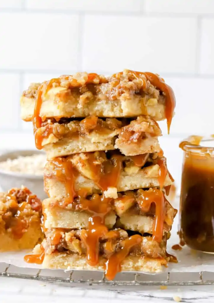 five caramel apple bars stacked on top of each other