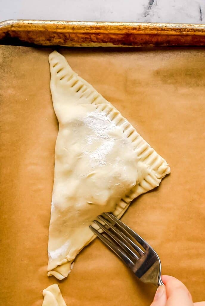crimping edges of puff pastry to seal