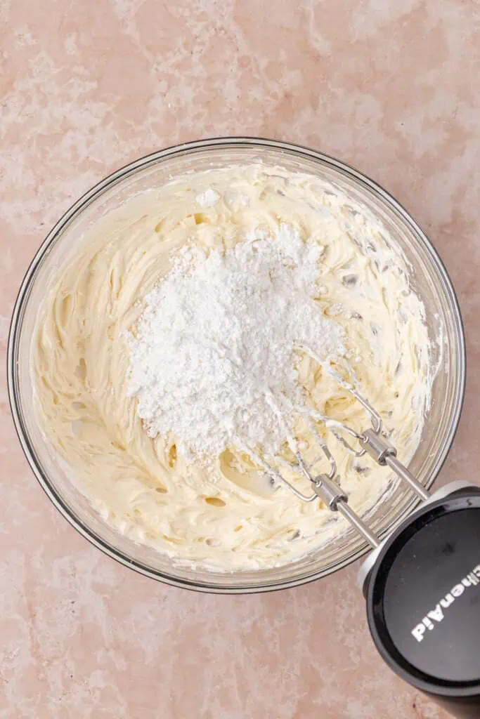 powdered sugar added to cream cheese frosting mixture