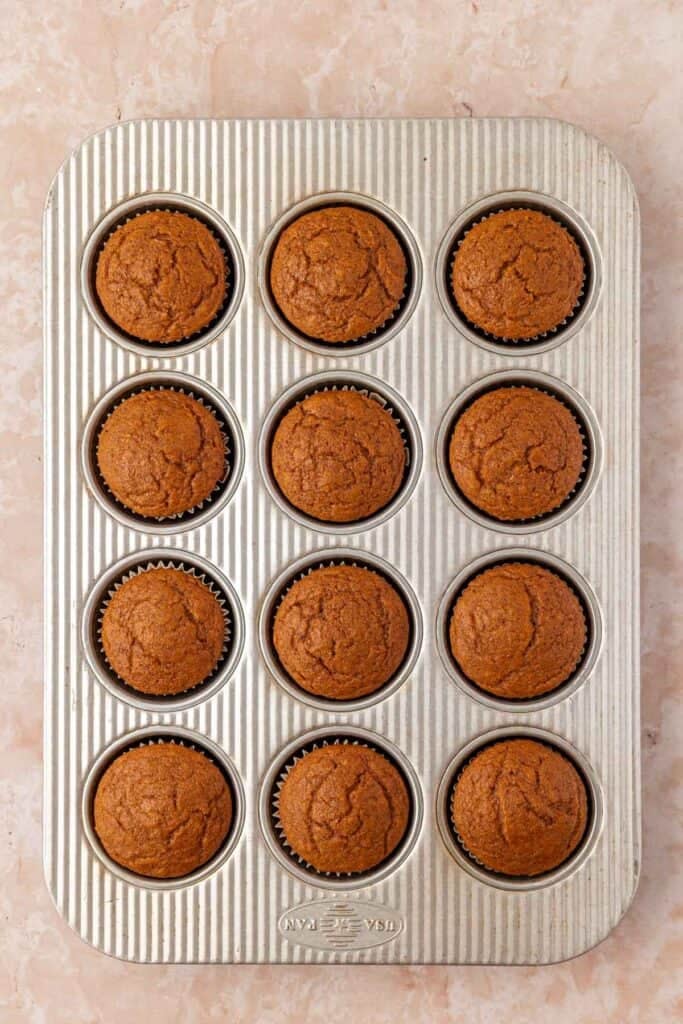 baked pumpkin cupcakes in a pan