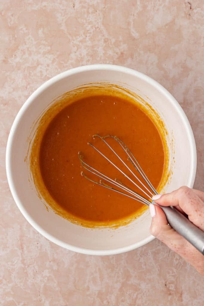 pumpkin cupcake wet ingredients in a bowl whisked together