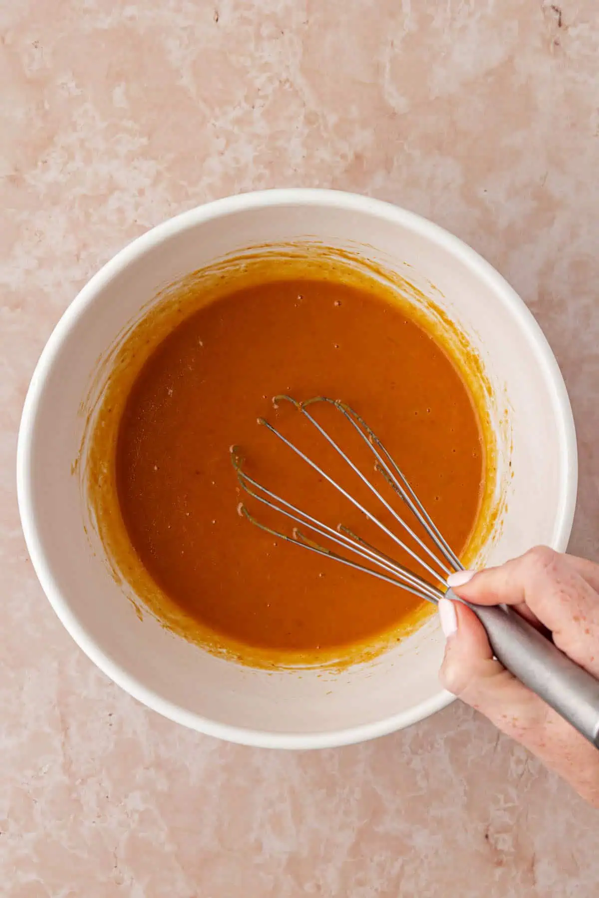 pumpkin cupcake wet ingredients in a bowl whisked together
