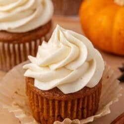pumpkin cupcake topped with cream cheese frosting