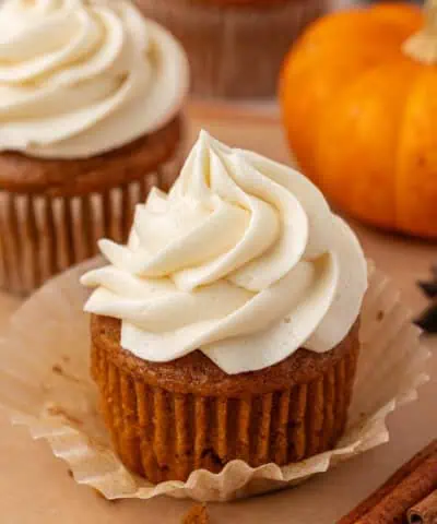 pumpkin cupcake topped with cream cheese frosting