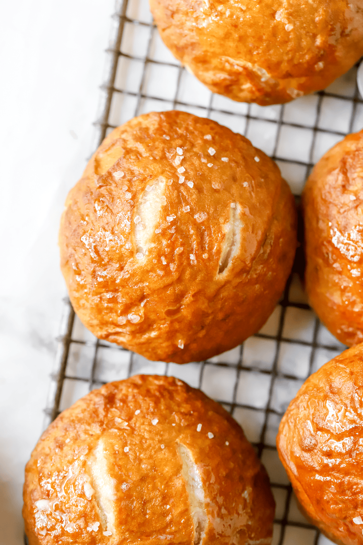 pretzel buns on a wire rack