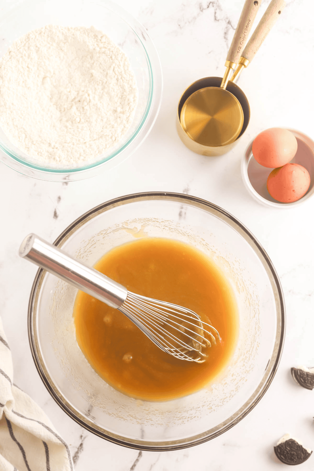 blondie wet ingredients in bowl with a whisk