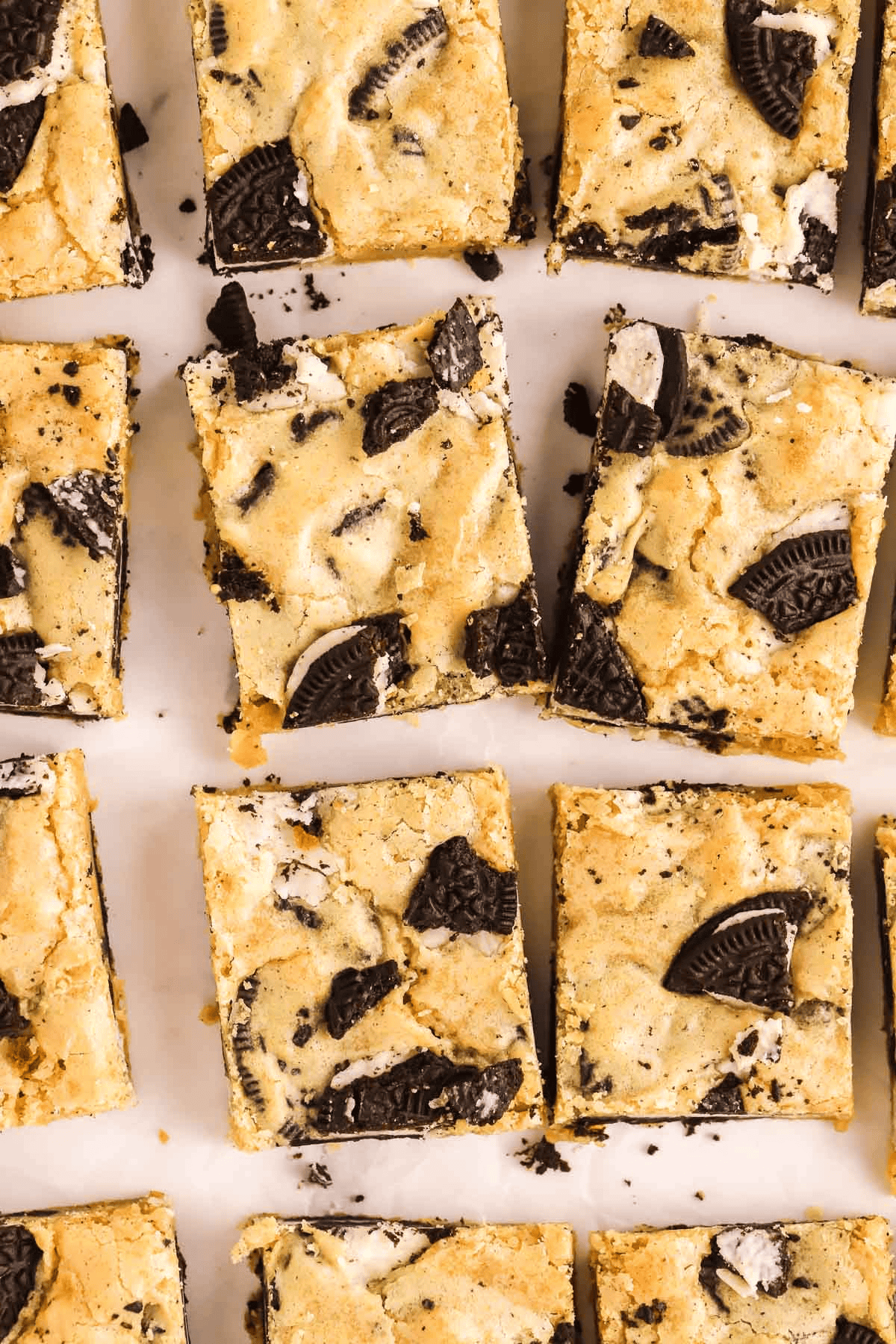 cut up Oreo blondies on parchment paper 