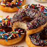 chocolate frosted donut with a bite missing
