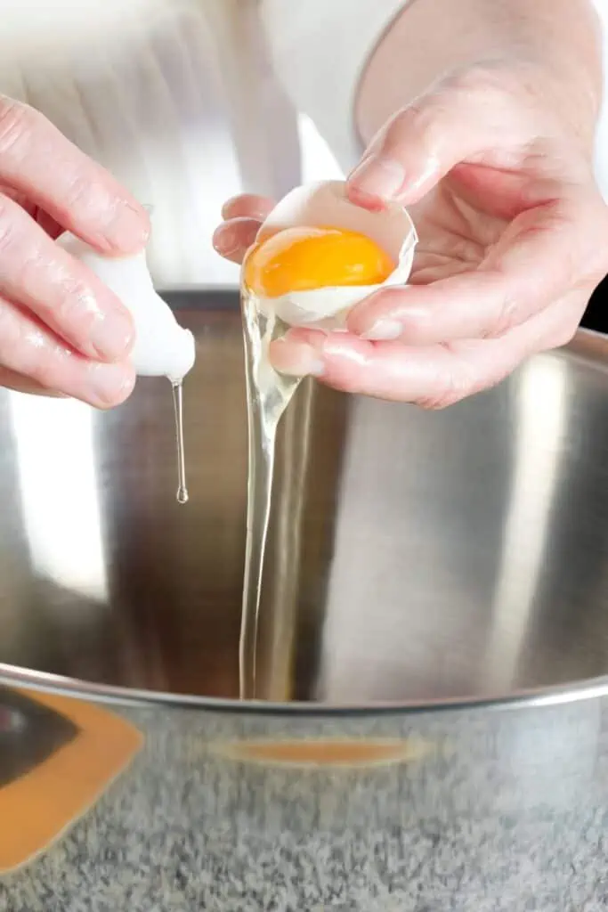 person separating an egg
