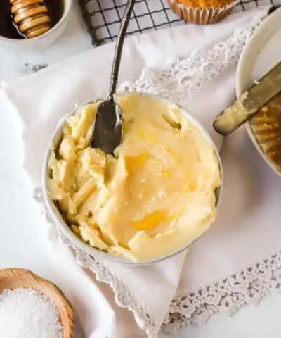 dish of honey butter with a butter knife in it