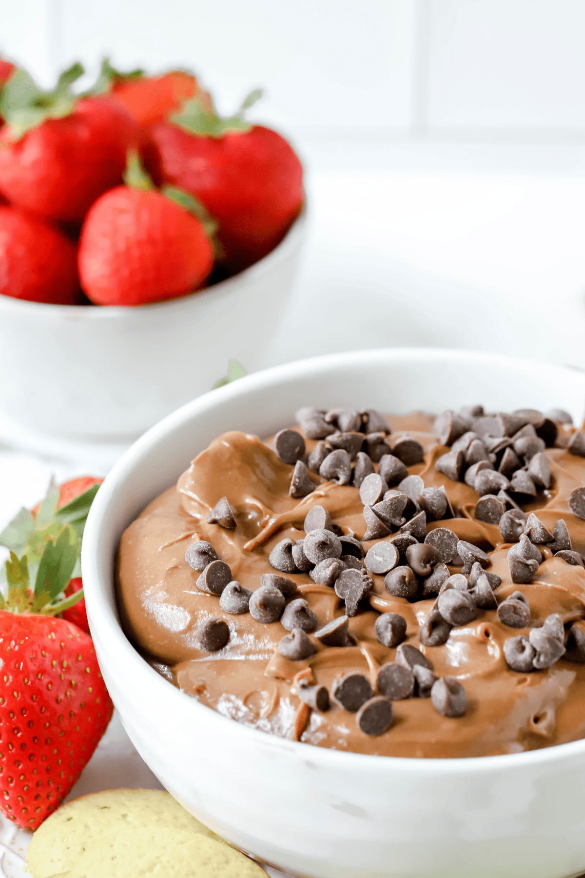 bowl of brownie batter dip and a bowl of fresh strawberries