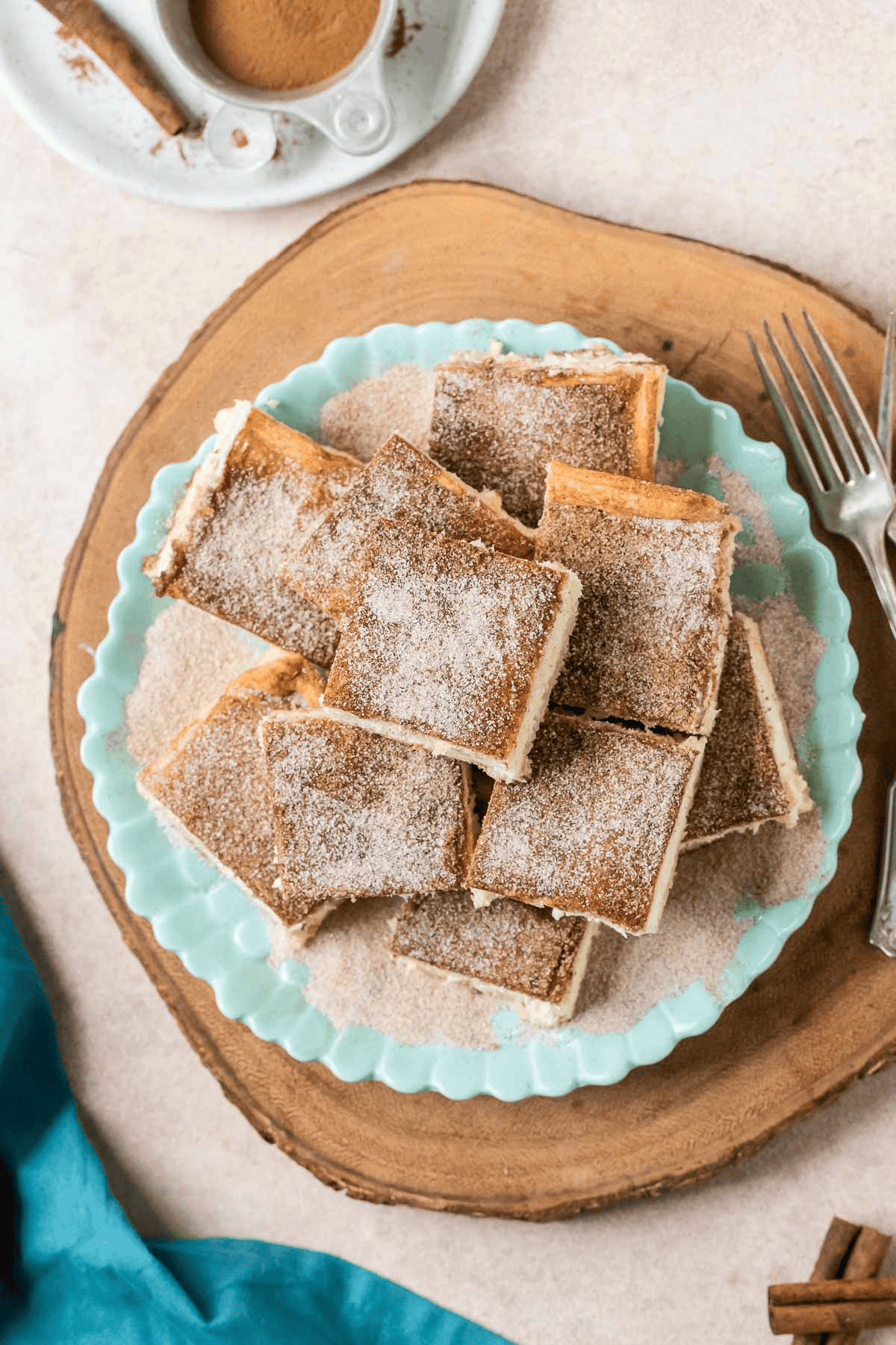 plate of churro cheesecake bars