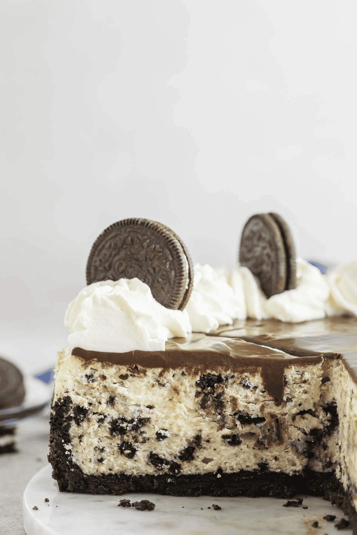 whole oreo cheesecake on a marble board