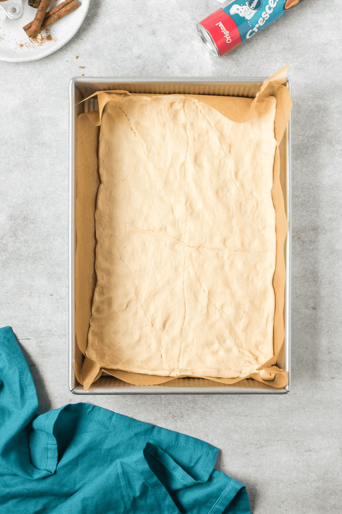 crescent roll dough rolled out into bottom of pan