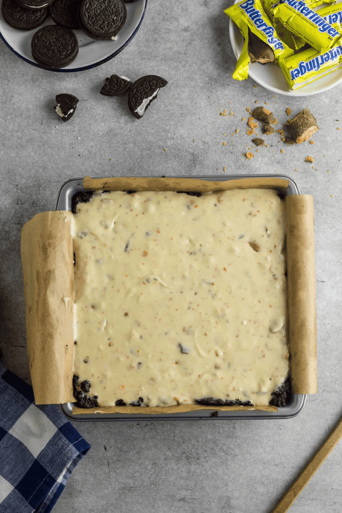butterfinger cheesecake batter in pan