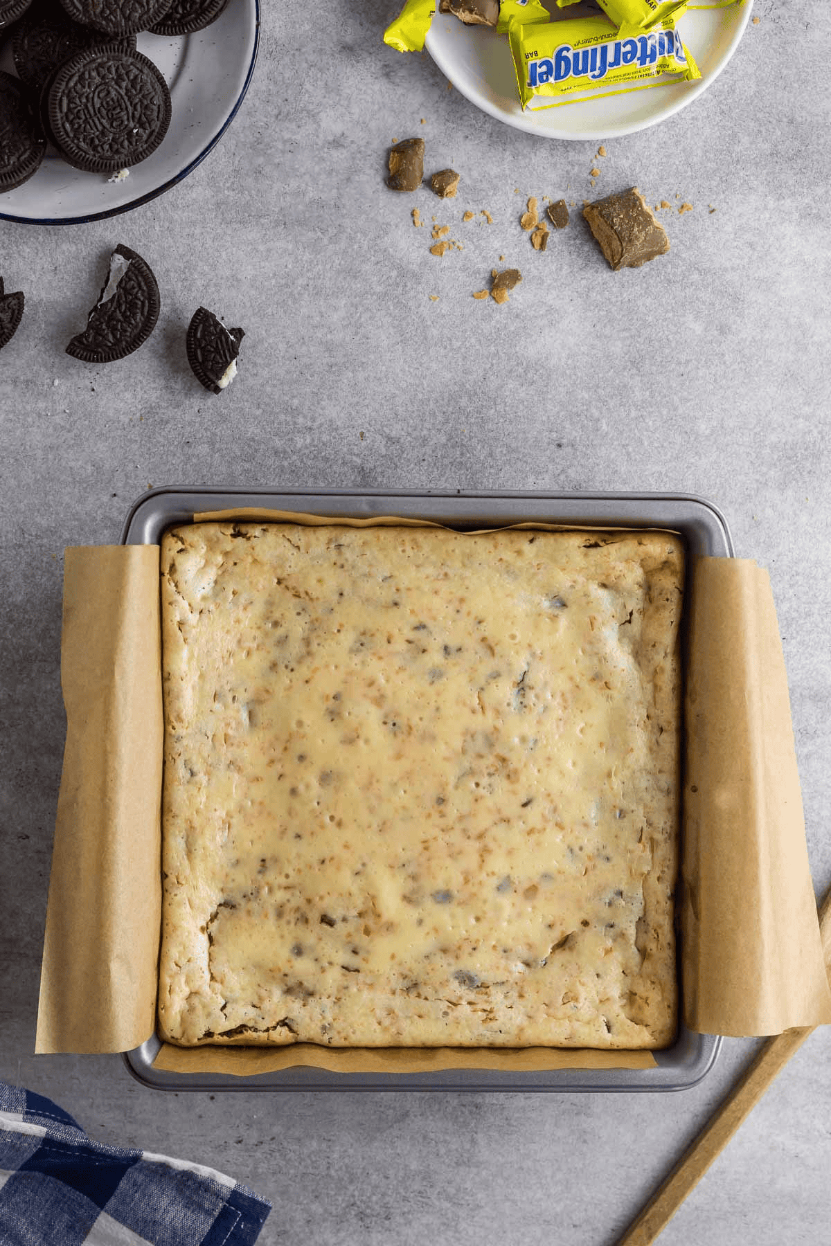 baked butterfinger cheesecake bars in pan