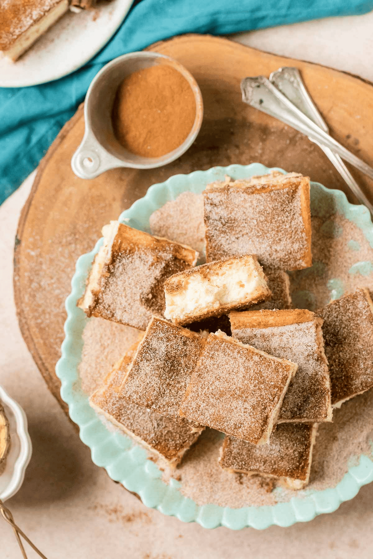 plate of churro cheesecake bars