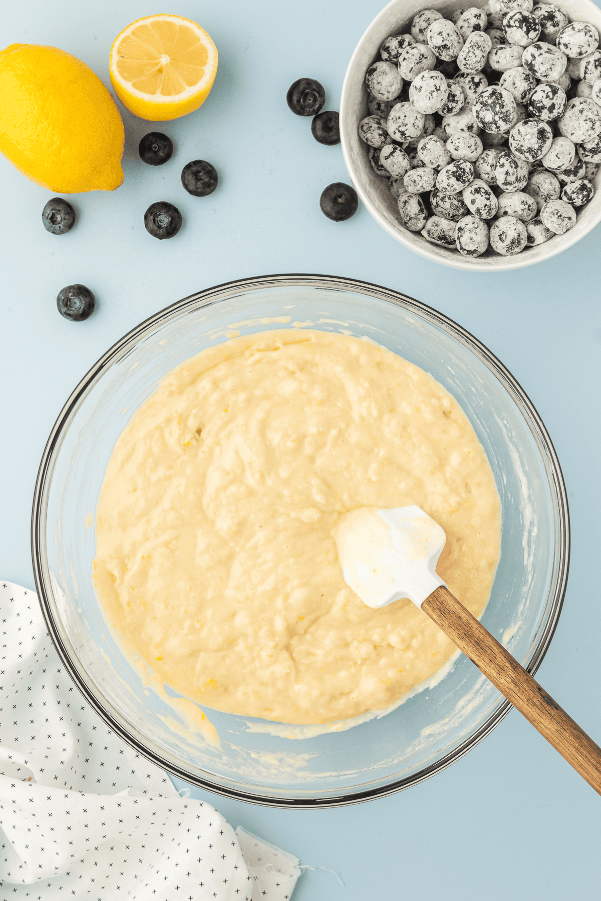 lemon blueberry quick bread batter in bowl with bowl of blueberries