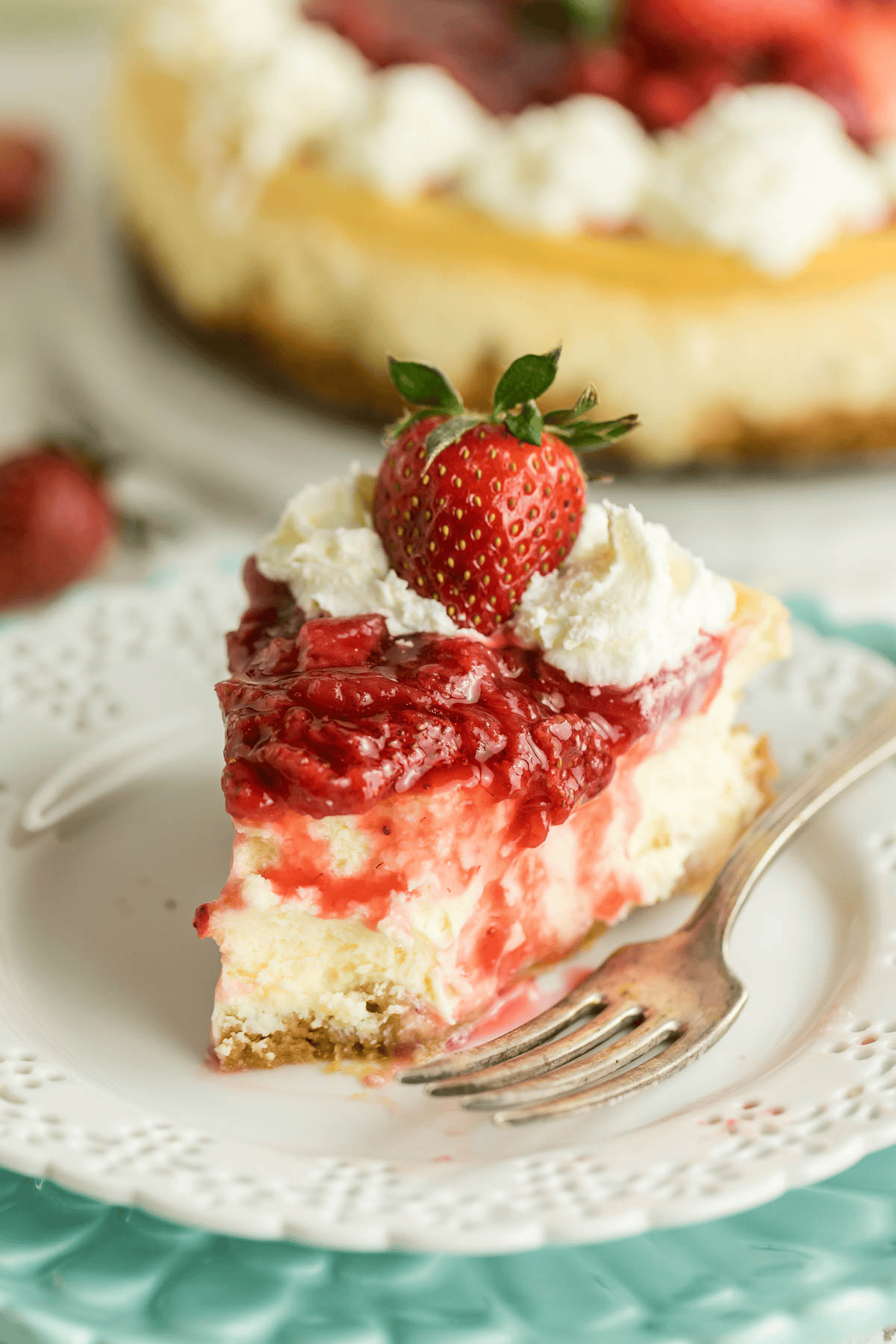 slice of strawberry cheesecake on a plate