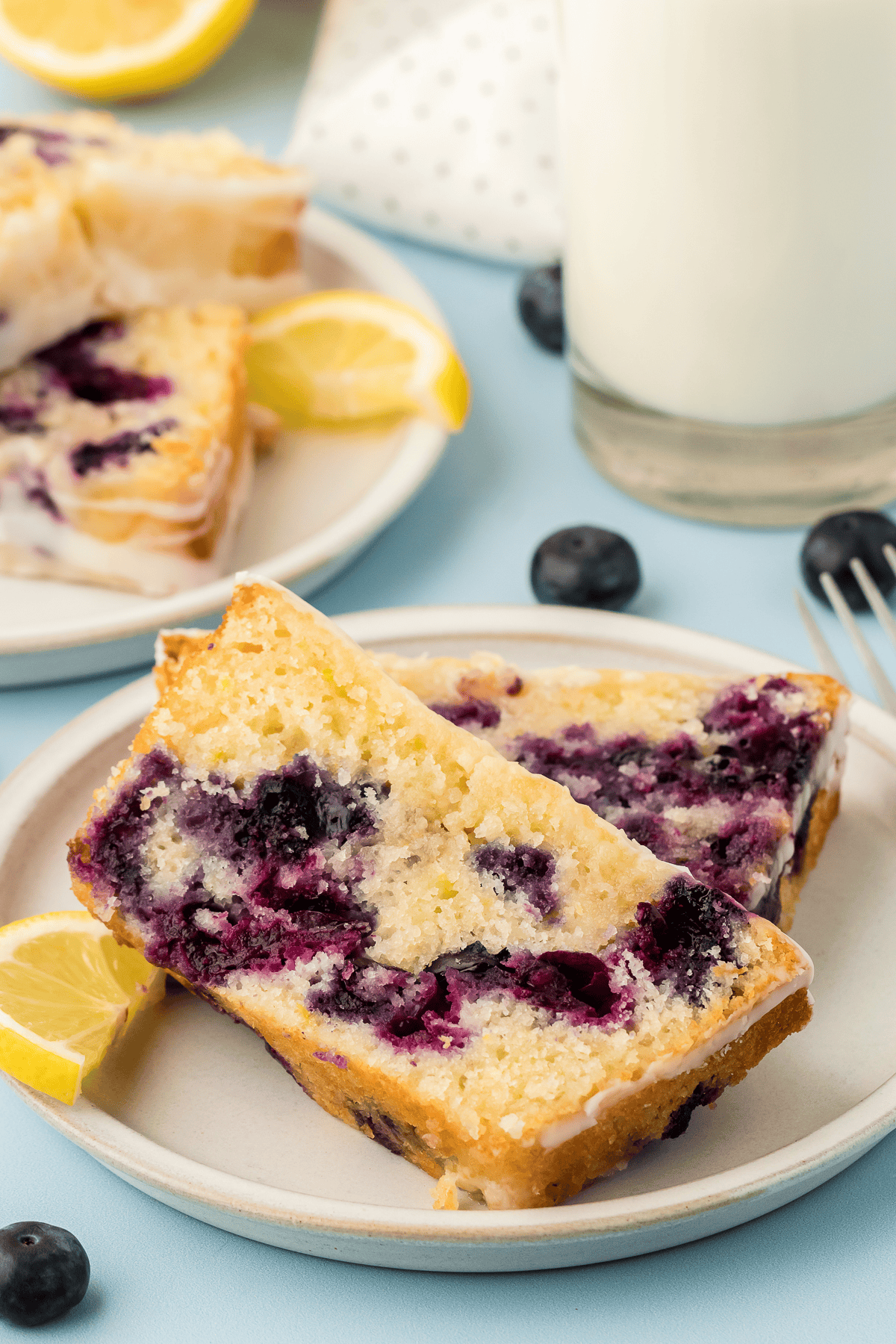 two slices of blueberry lemon bread on a plate