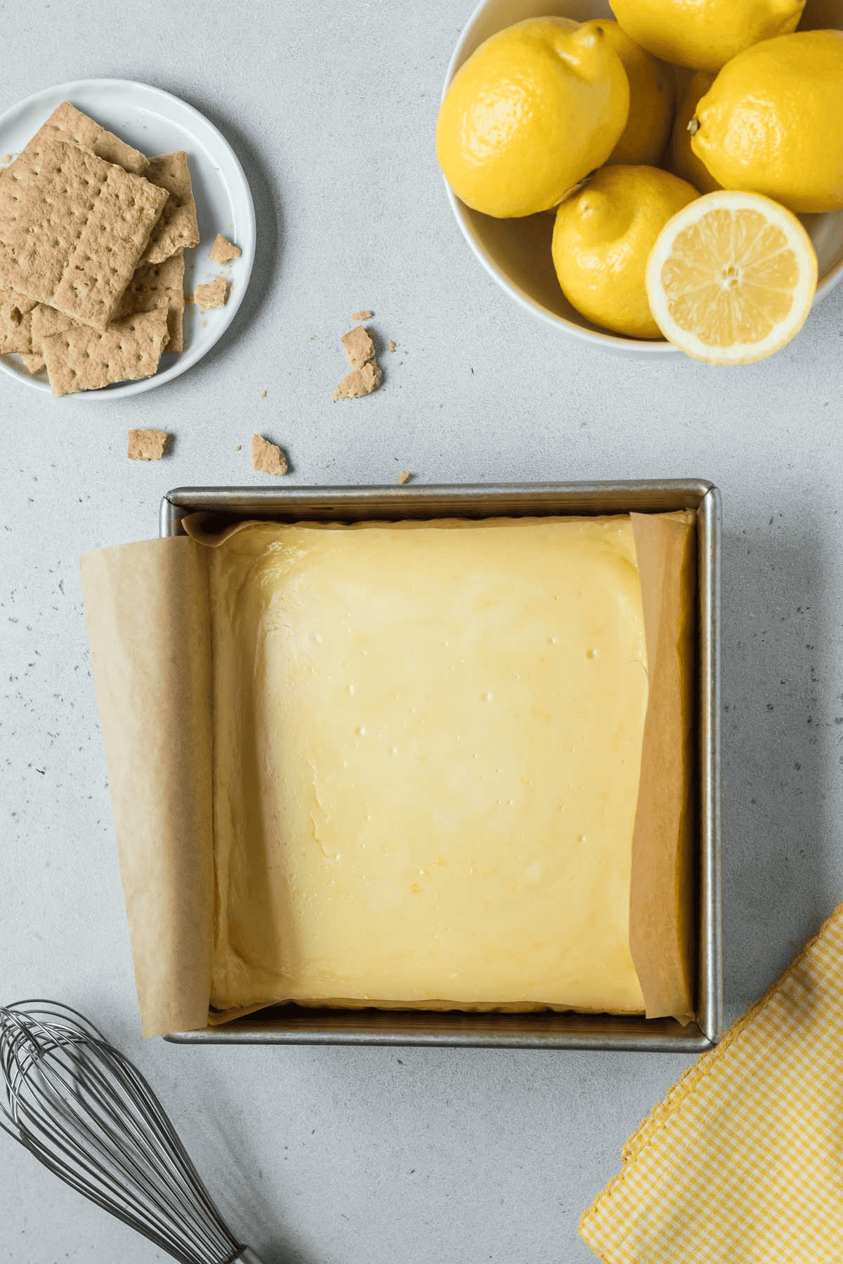 baked lemon cheesecake bars in baking dish