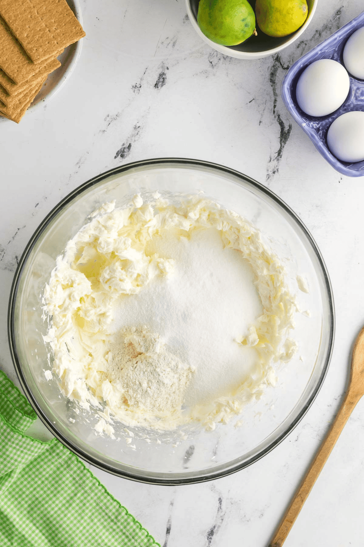 flour, sugar, and salt added to beaten cream cheese mixture in bowl