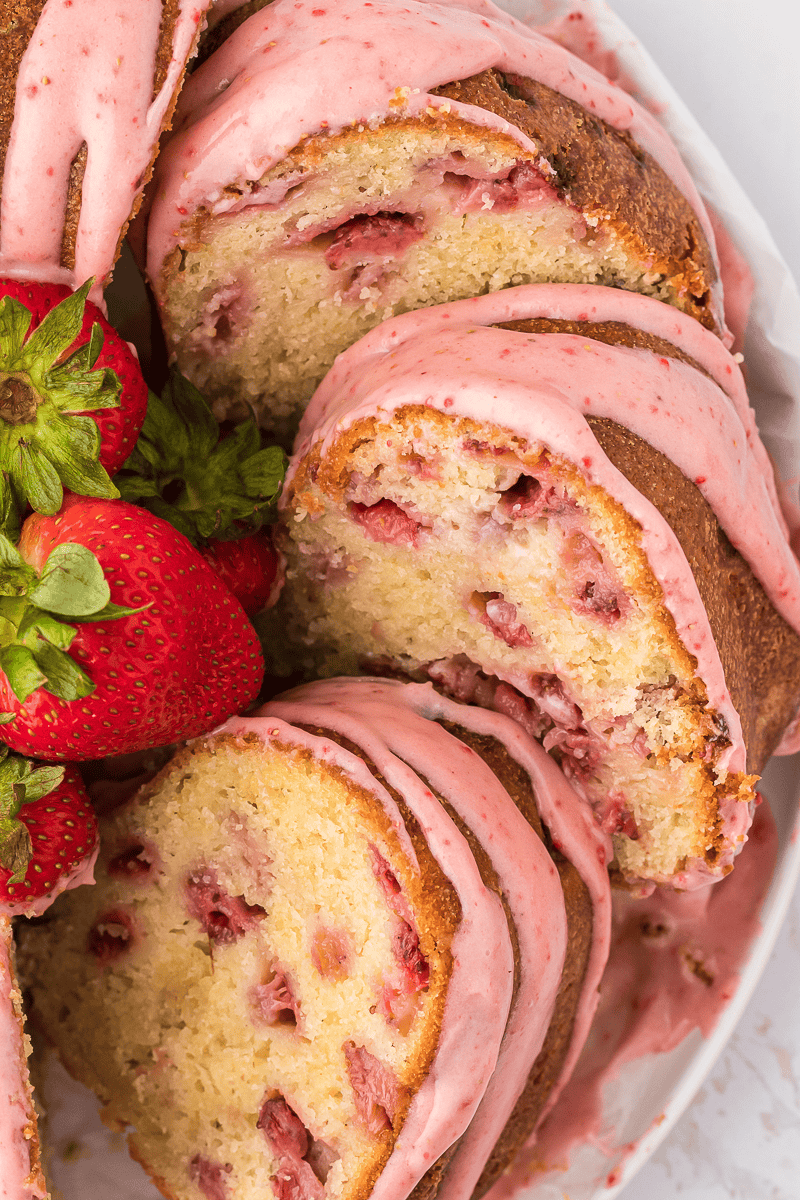 strawberry glazed pound cake sliced on a plate