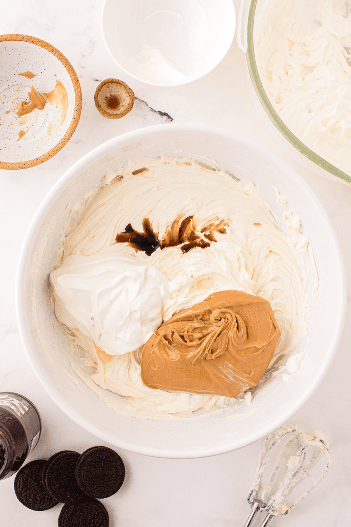 peanut butter, sour cream, and vanilla added to bowl of cheesecake mixture