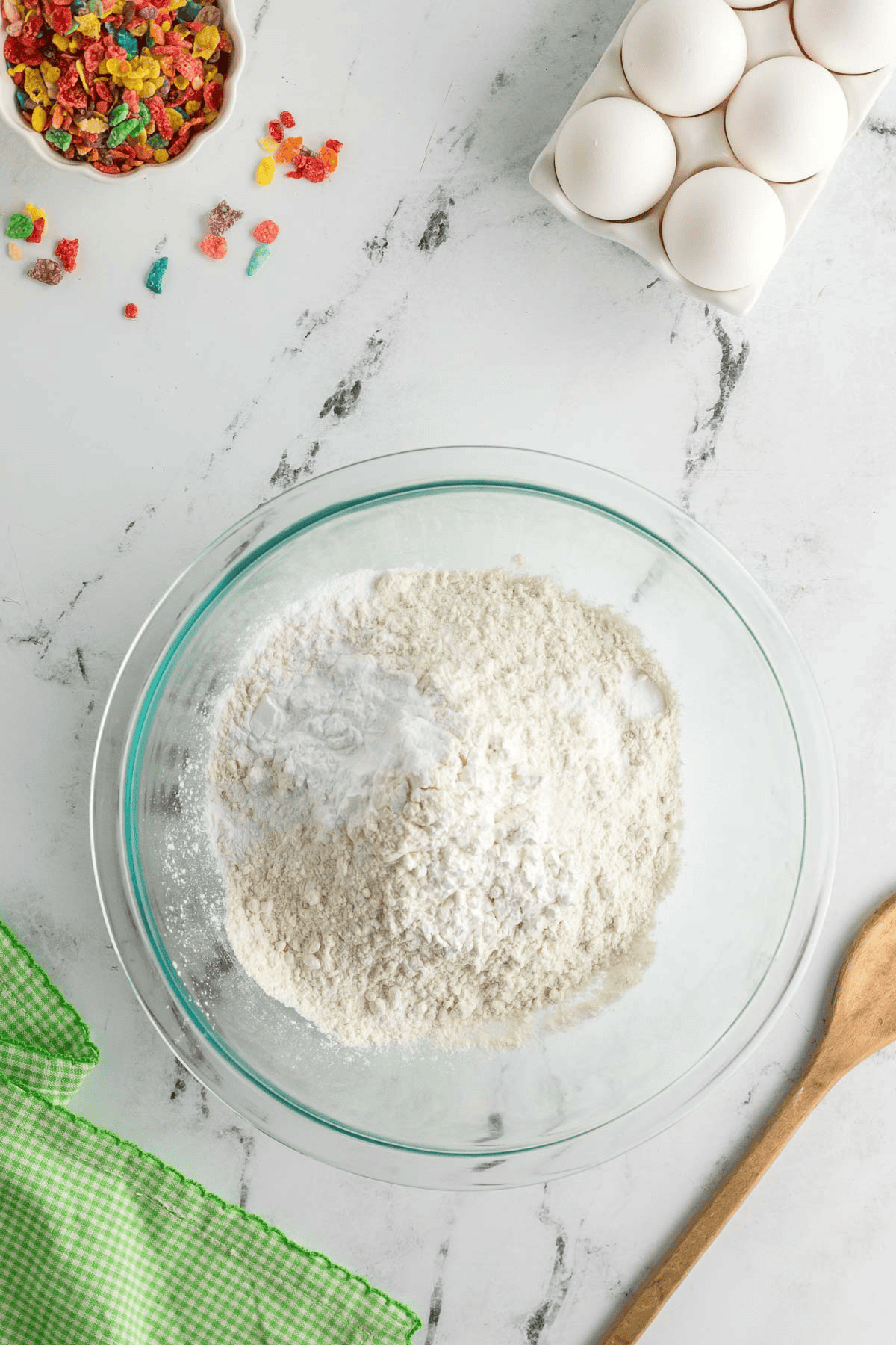 bowl of dry ingredients for fruity pebble cheesecake bars