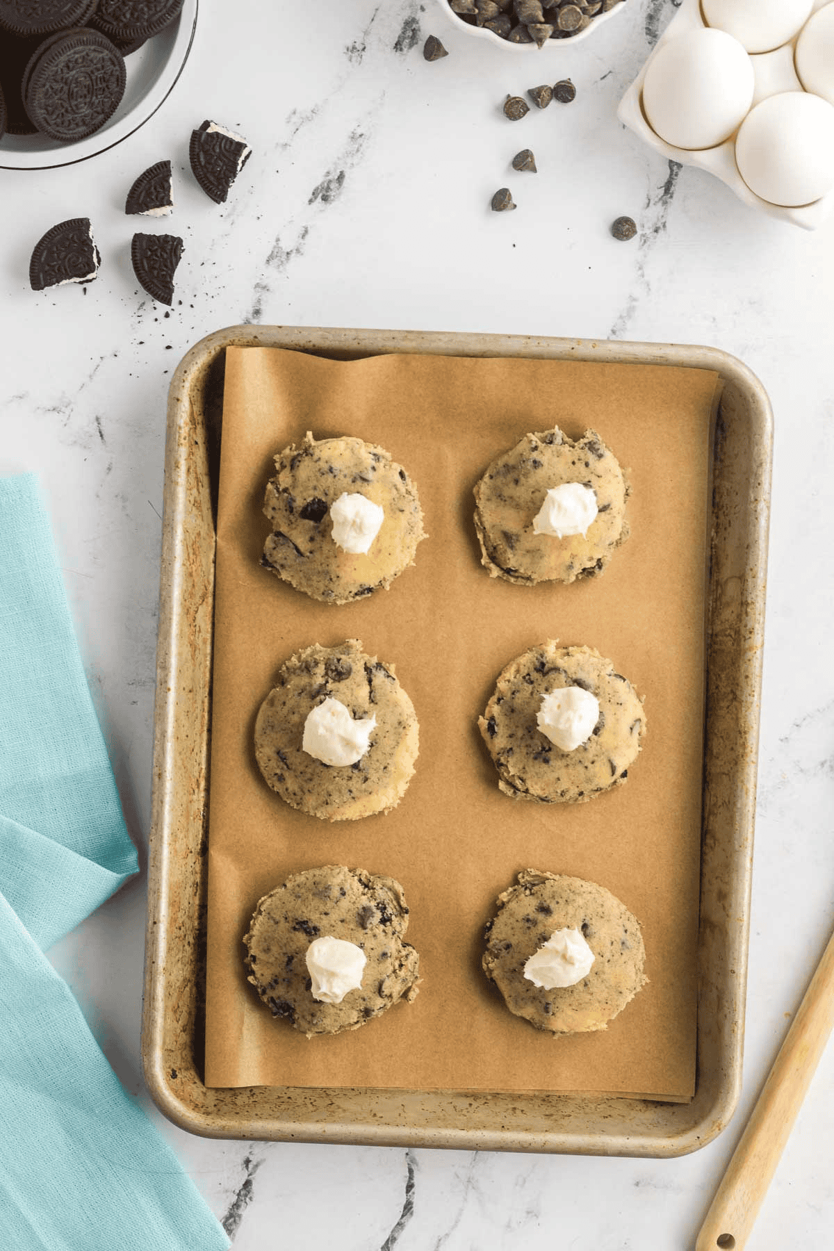 cream cheese filling in center of oreo cheesecake cookie dough balls
