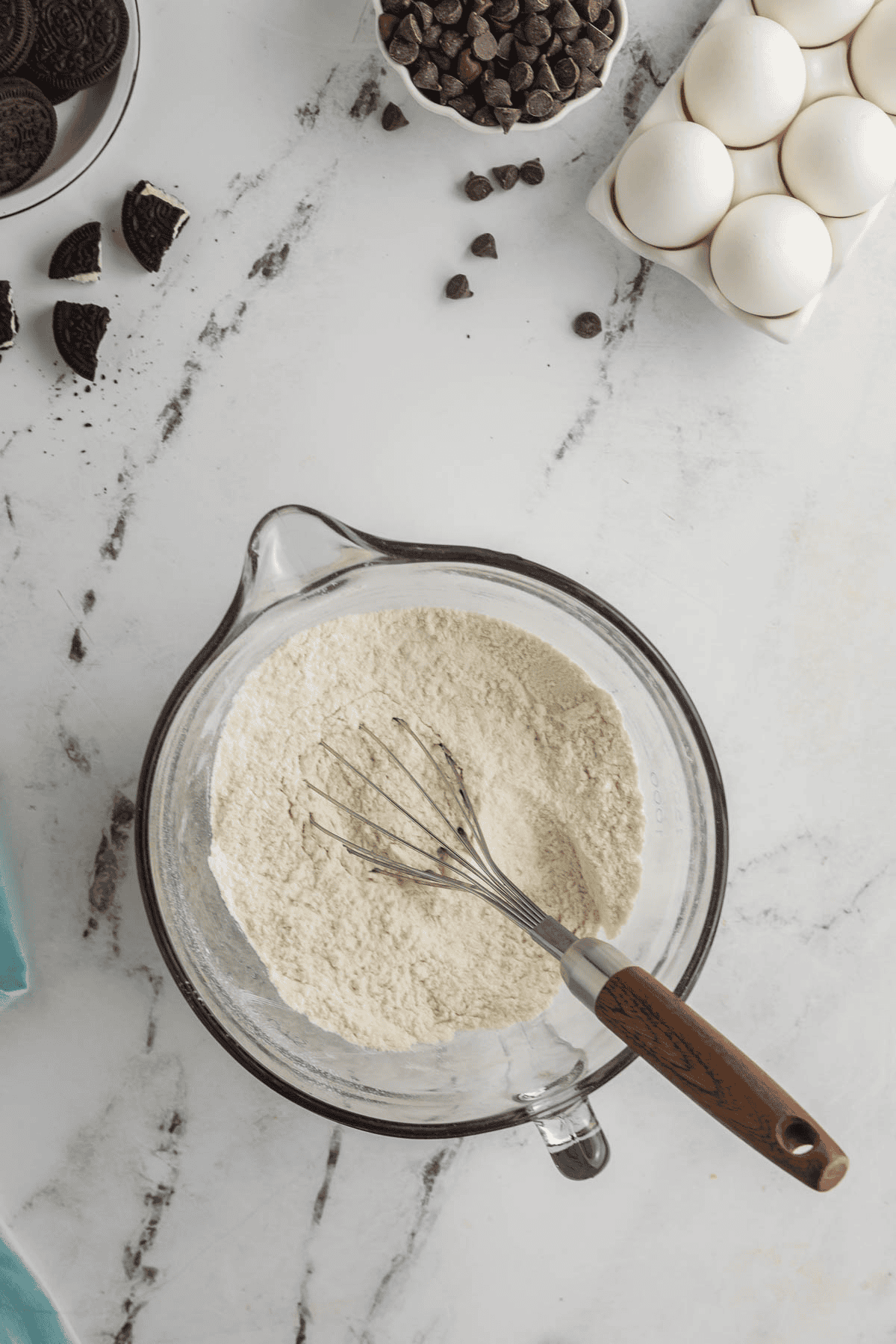 oreo cheesecake cookie dry ingredients in bowl with whisk