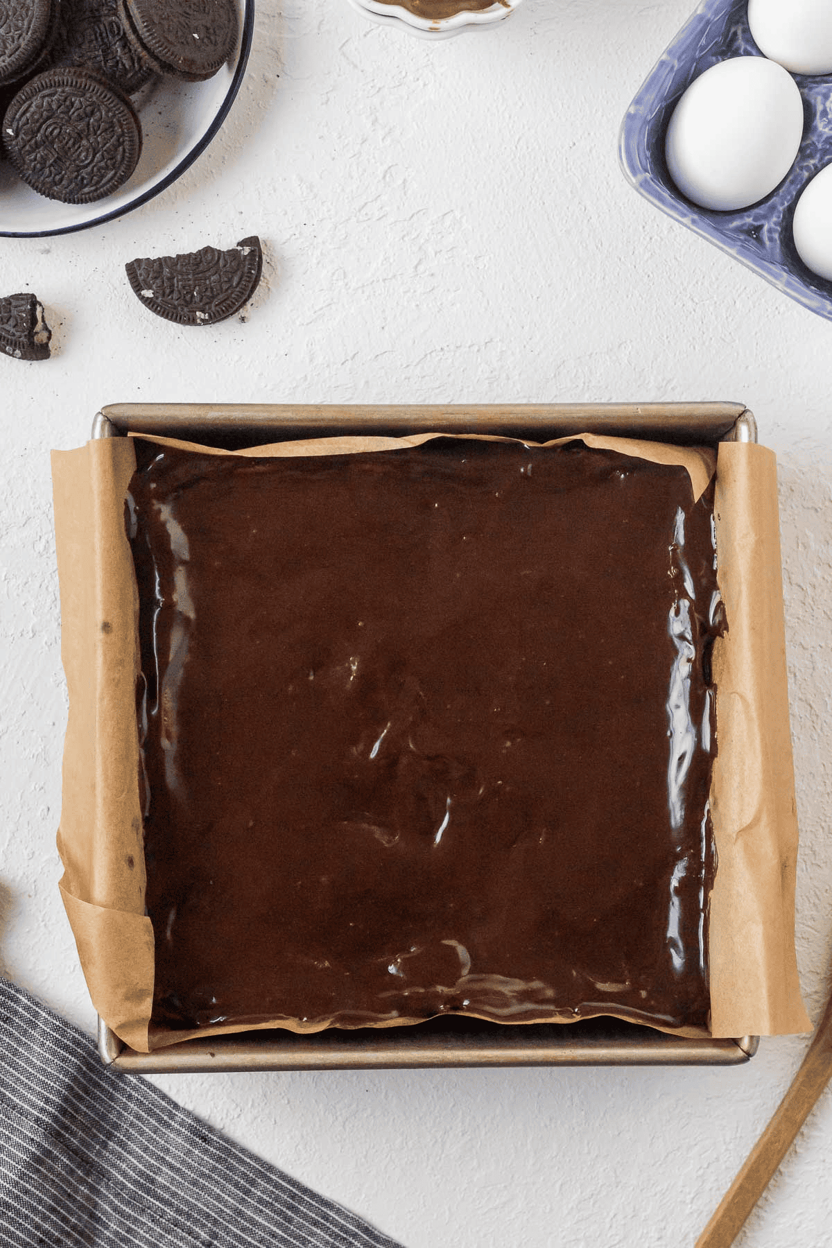 ganache spread on top of cheesecake bars