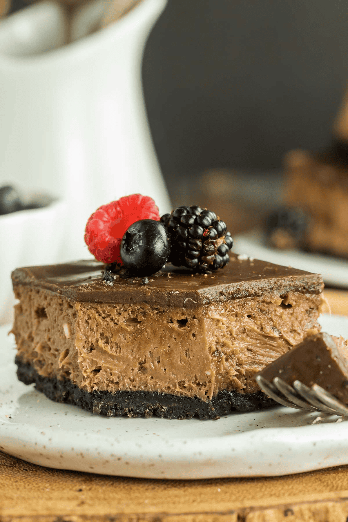 Nutella cheesecake bar on a plate with a fork