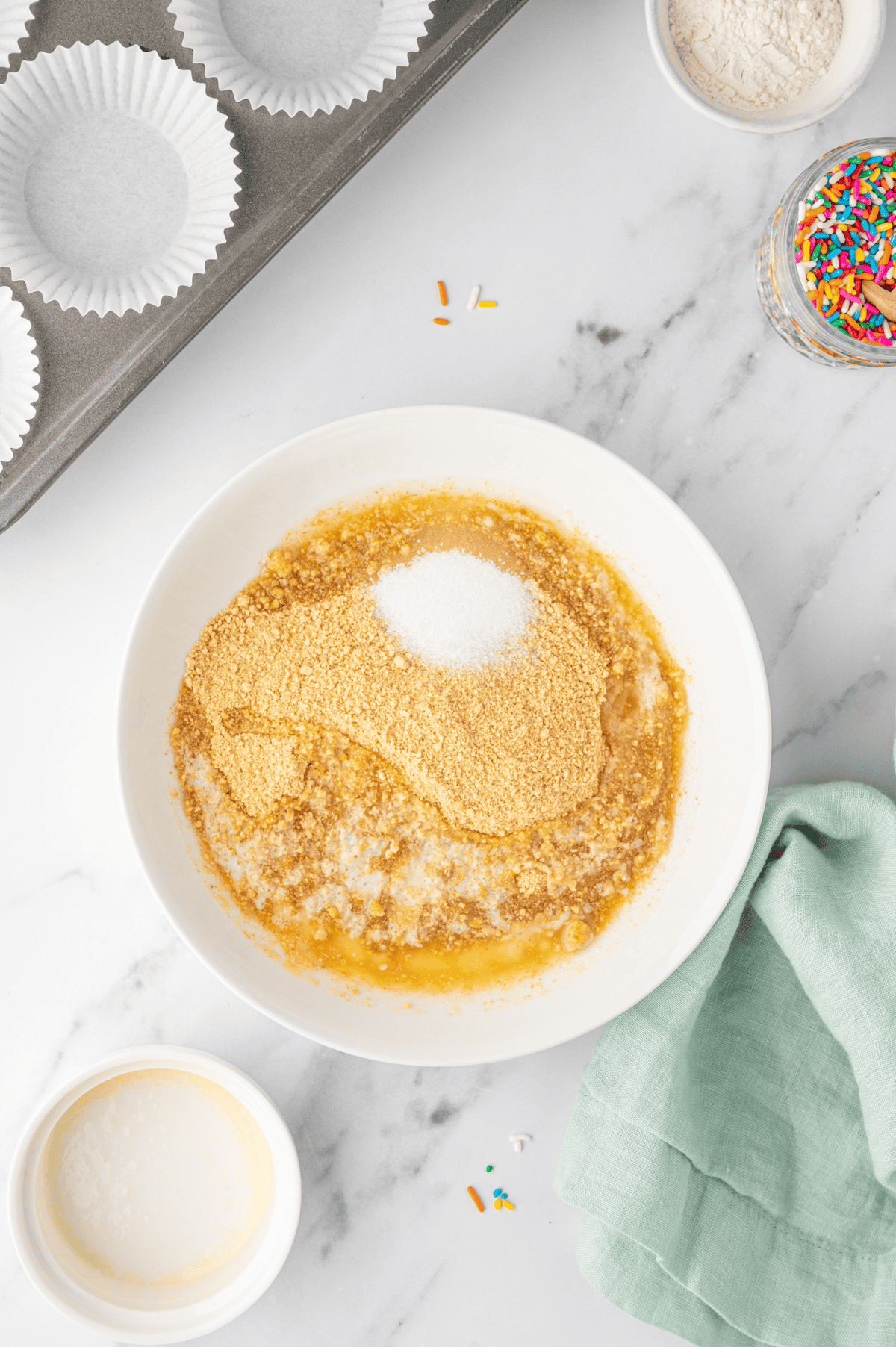 graham crackers crumbs, sugar, and melted butter in bowl