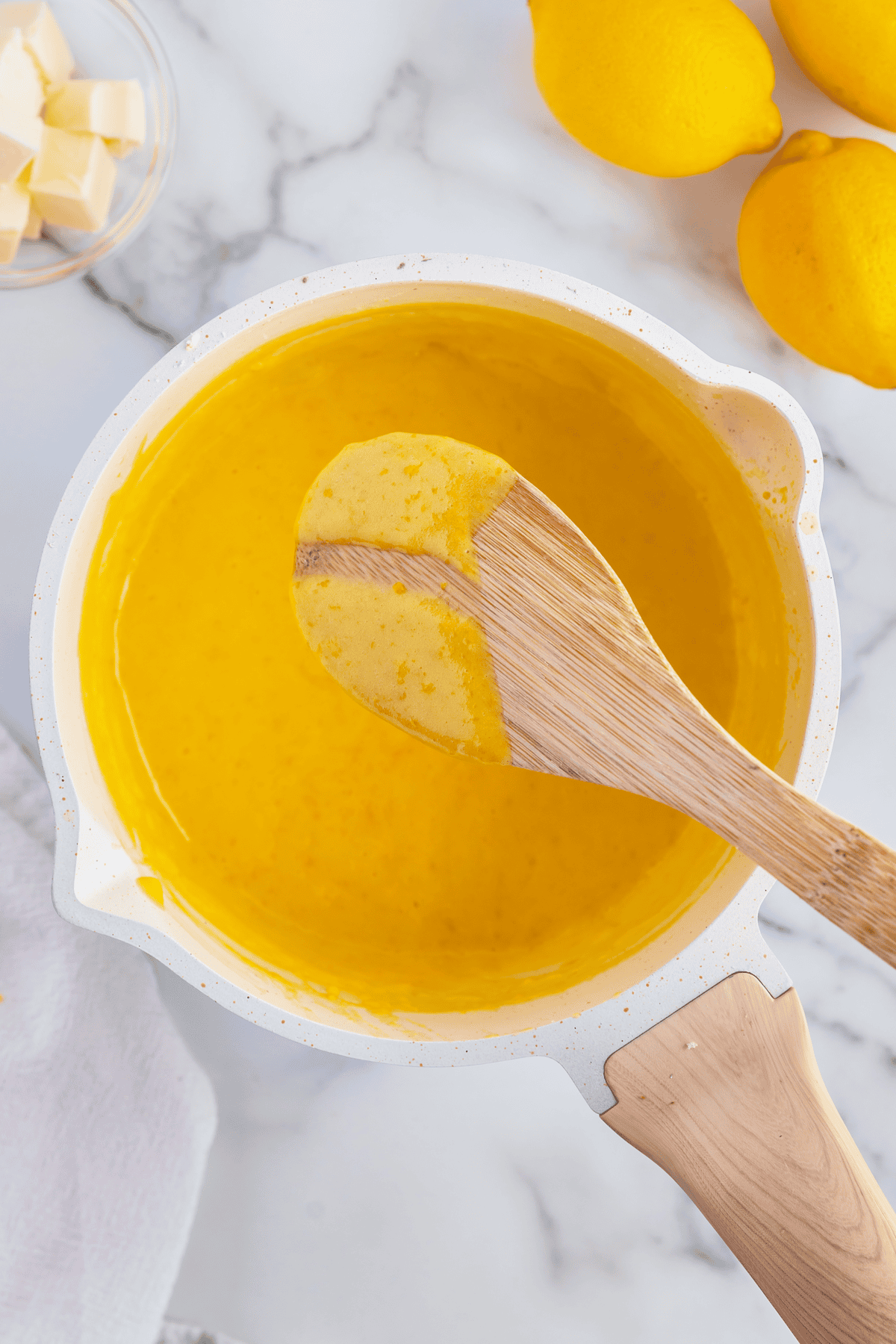wooden spoon with lemon curd on it
