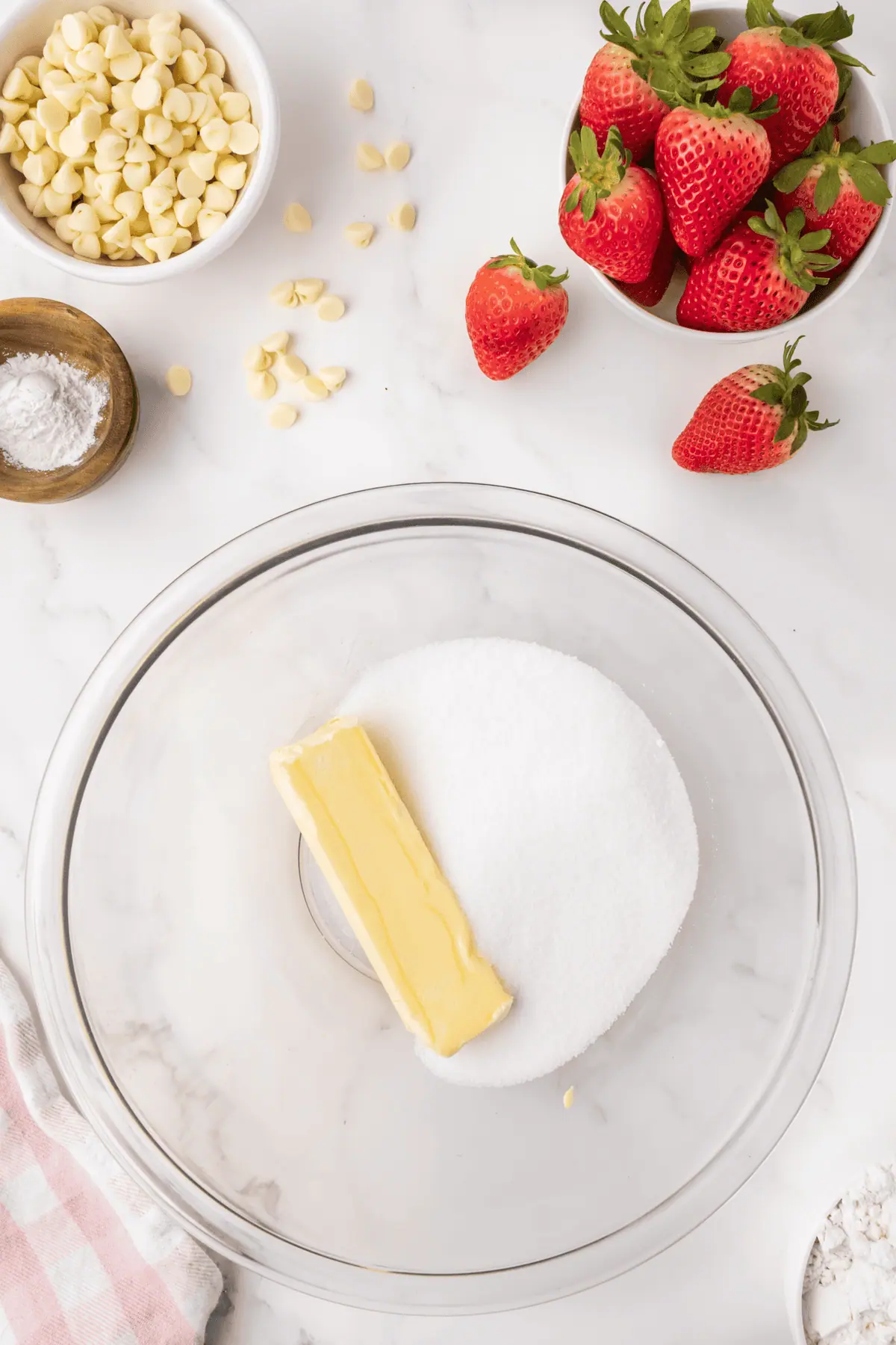 a stick of butter and sugar in bowl