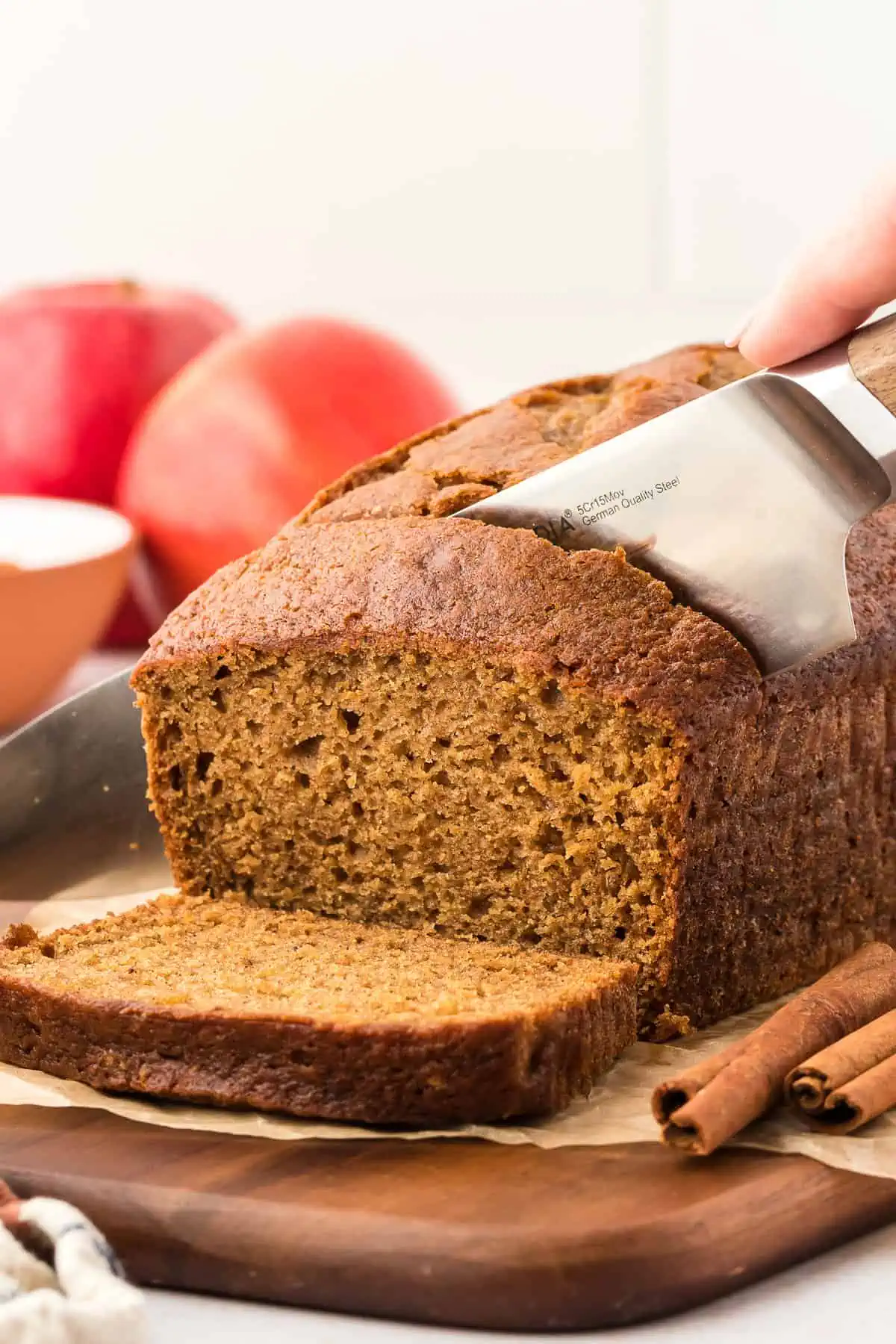 knife cutting through applesauce bread