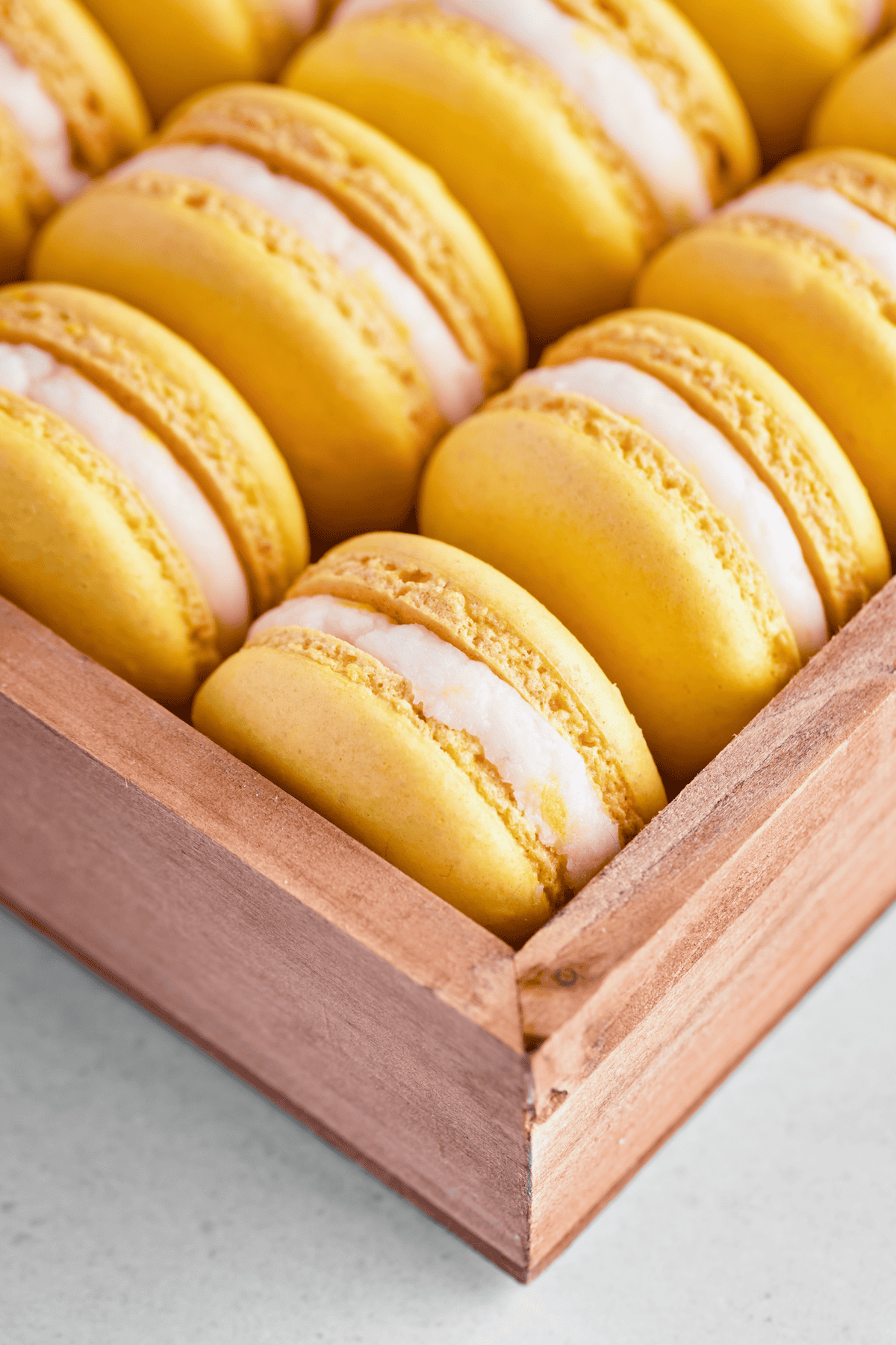 lemon macarons in a wooden box