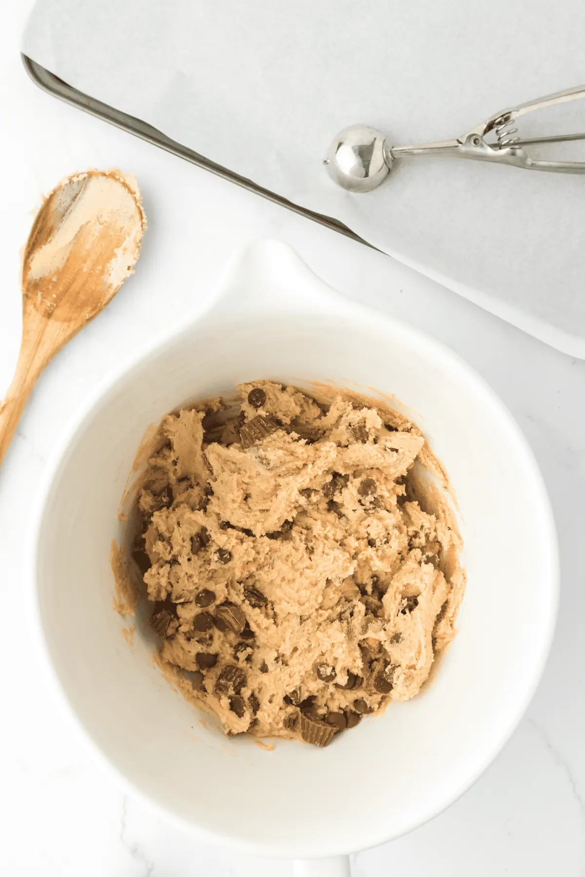 peanut butter cups and chocolate chips added to cookie dough