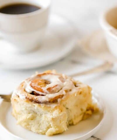 cinnamon roll topped with cream cheese frosting