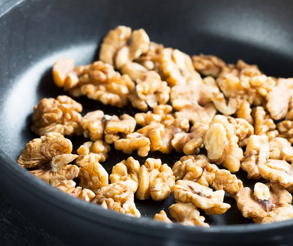 walnut halves in a skillet