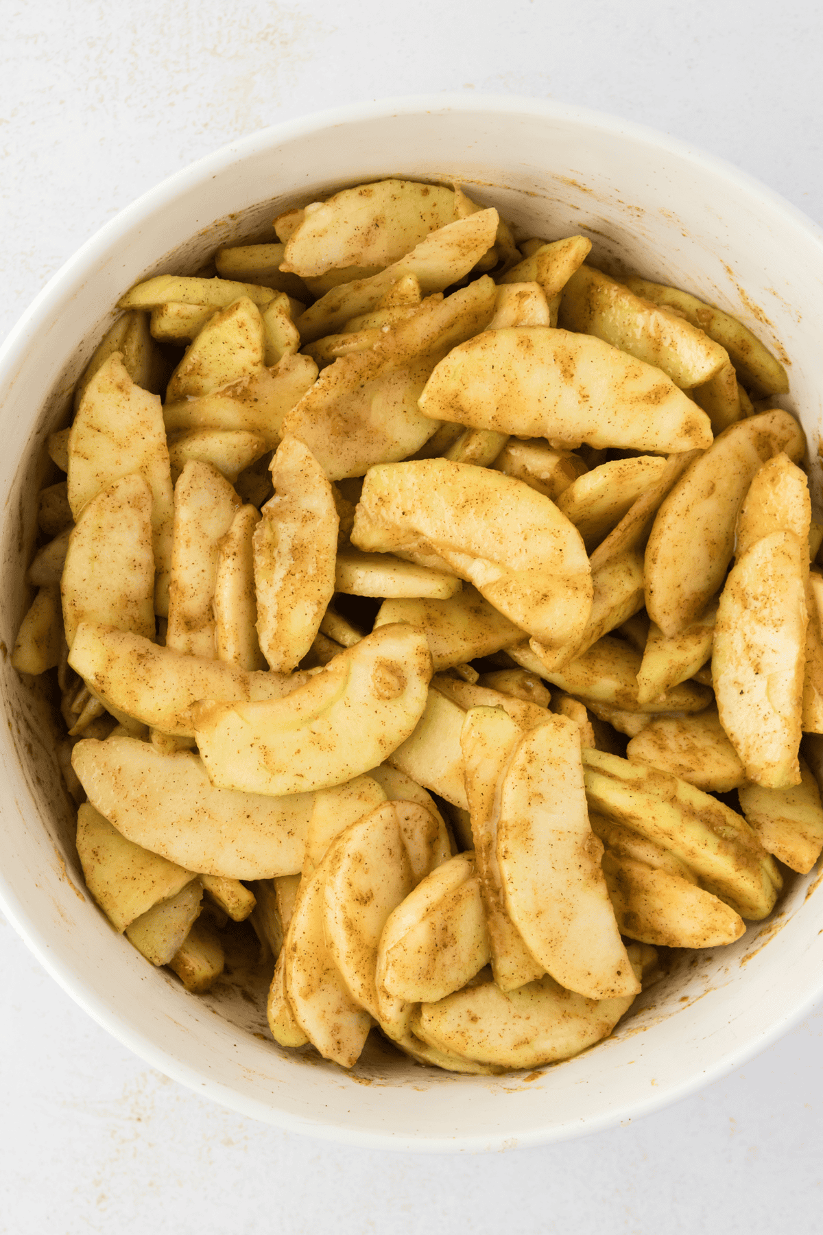 sliced apples for pie in a bowl
