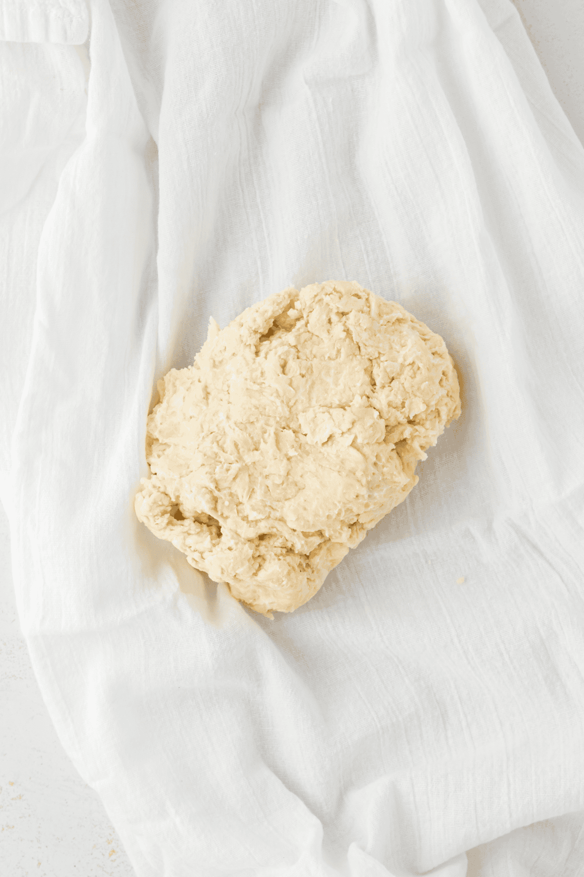 pie dough in a tea towel