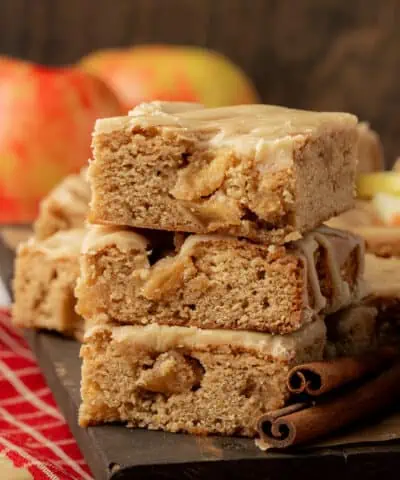 three caramel apple blondies stacked on top of each other