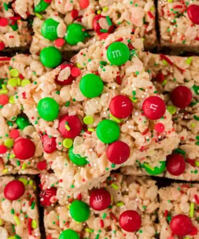 christmas rice krispy treat squares topped with red and green m&ms